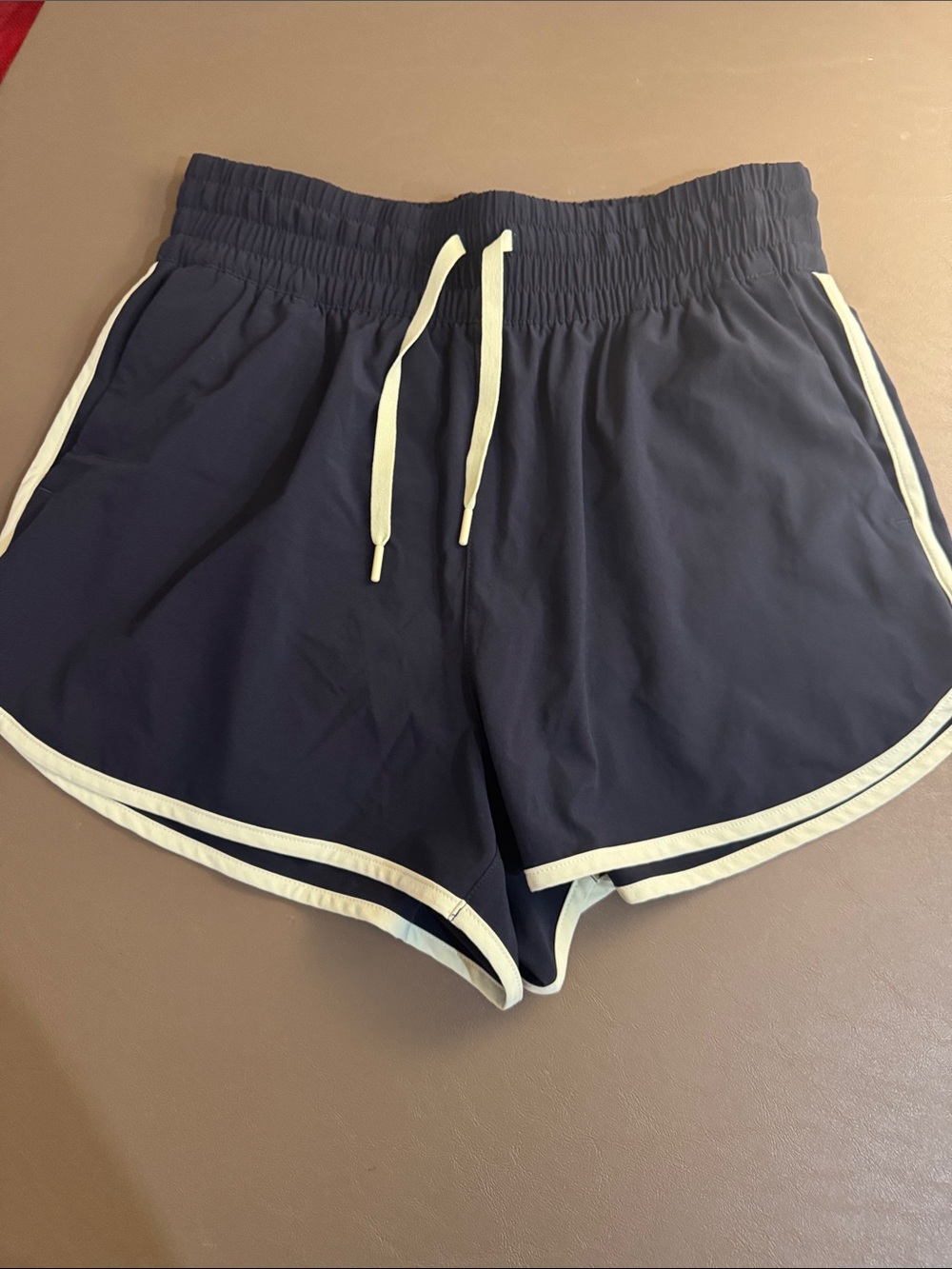 Athleta  Navy weekend run Shorts with light green trim xs